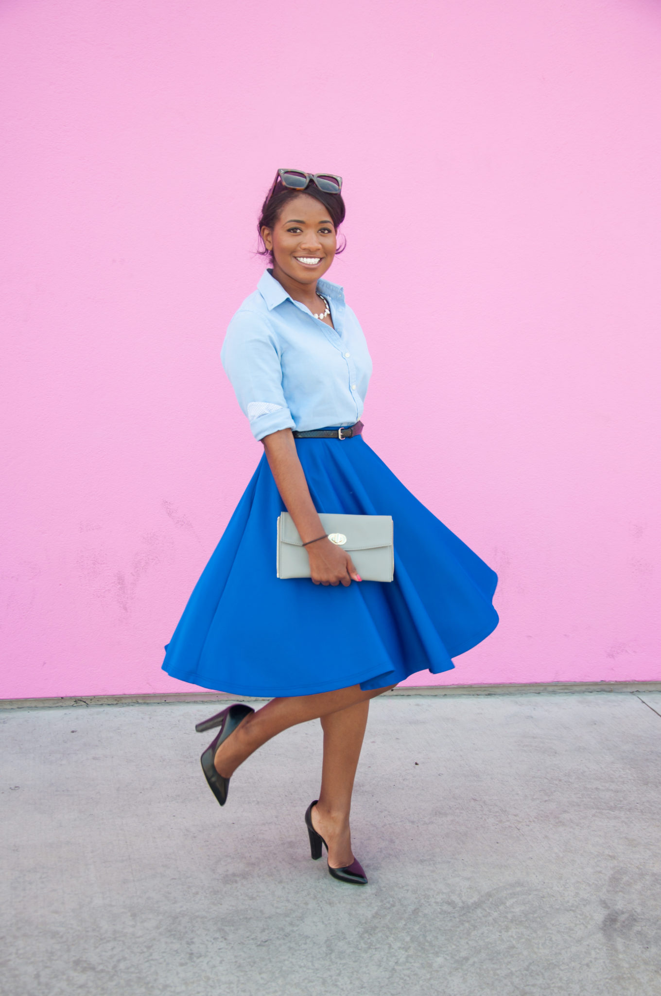 Monochromatic outfit with blue midi skirt at the pink wall in los angeles - downtown demure