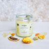 a coconut soy wax prayer candle with citrine crystal to promote joy